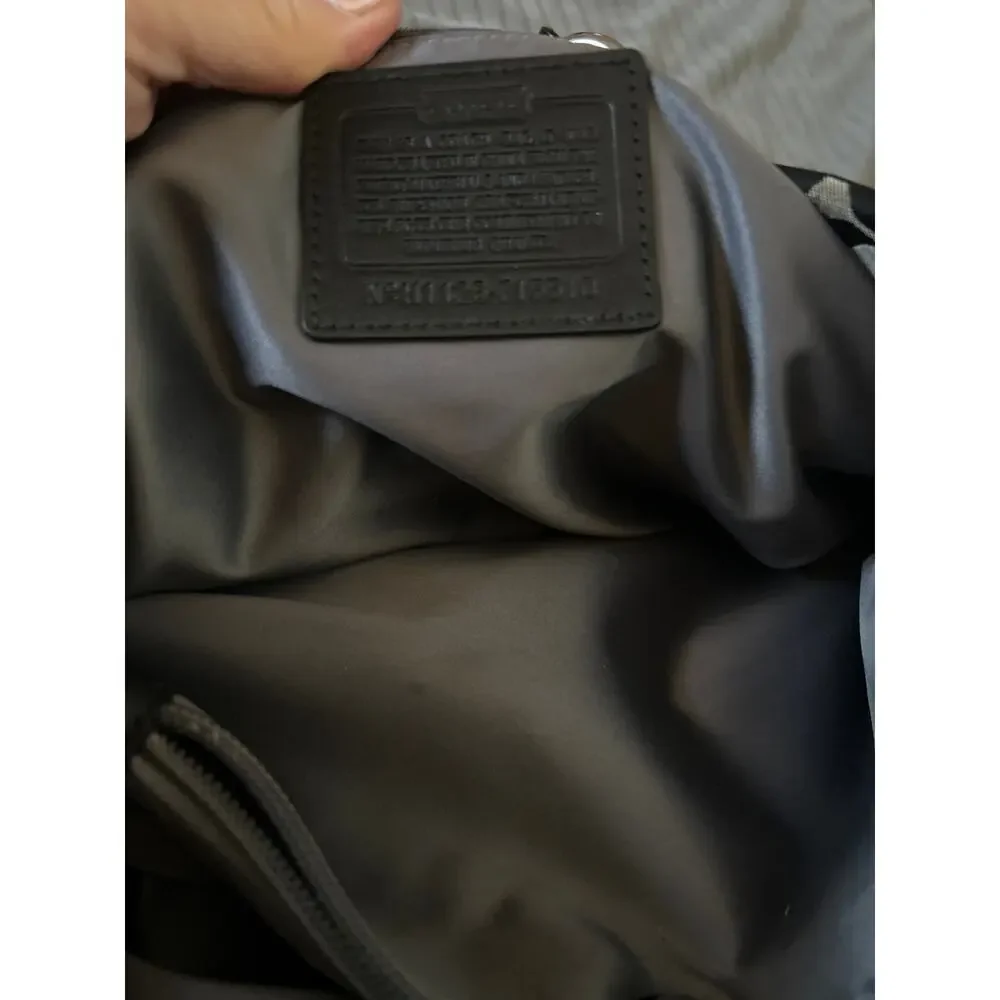 Coach Ashley Signature Canvas Handbag in Black and Gray.